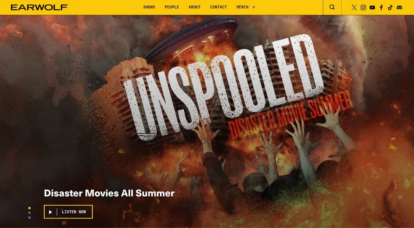 Earwolf homepage with yellow nav bar featuring the "Unspooled" show and a "Disaster Movies All Summer" banner