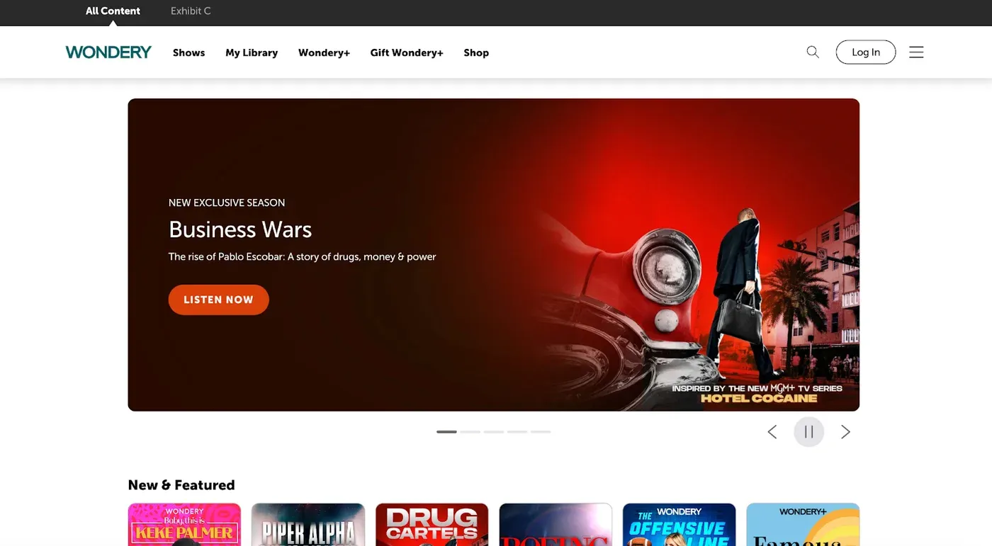 Wondery website homepage with a featured "Business Wars" hero banner and a "New & Featured" show row below