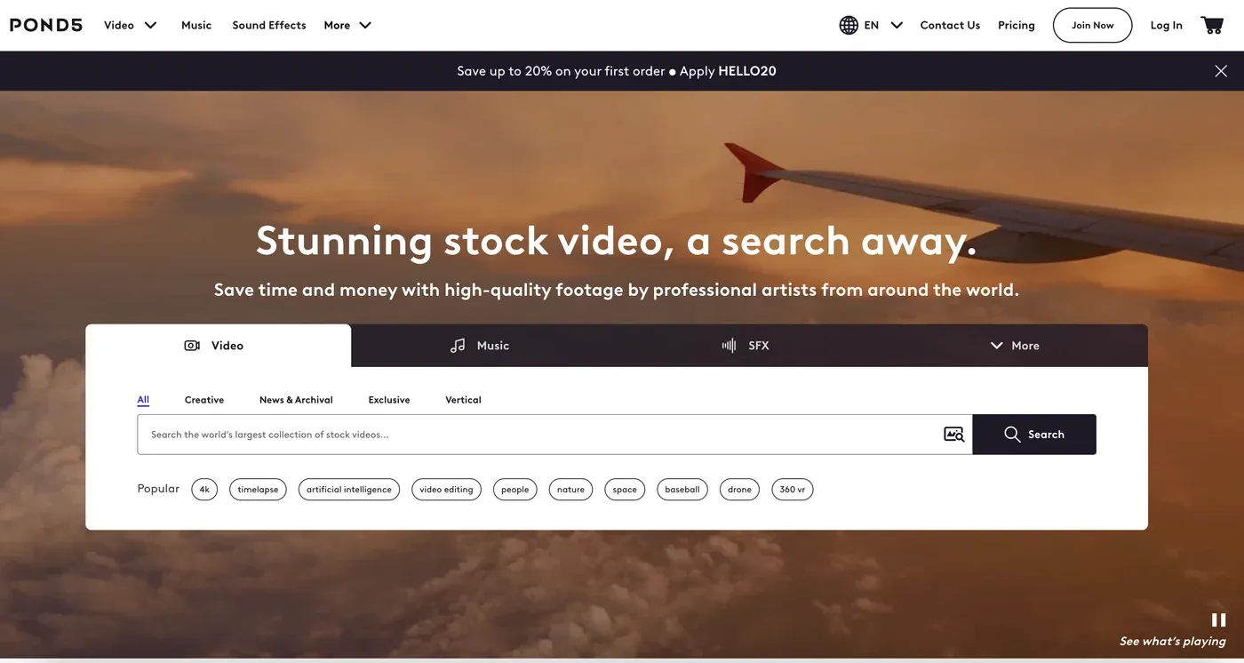 Pond5 homepage headline "Stunning stock video, a search away." over an airplane wing at sunset with a search bar