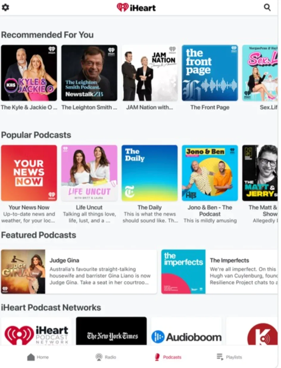 iHeart podcast app showing "Recommended For You" and "Popular Podcasts" rows with show cover tiles like The Daily